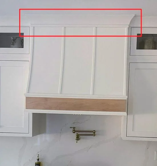 Proud hood top projecting beyond the cabinet fronts